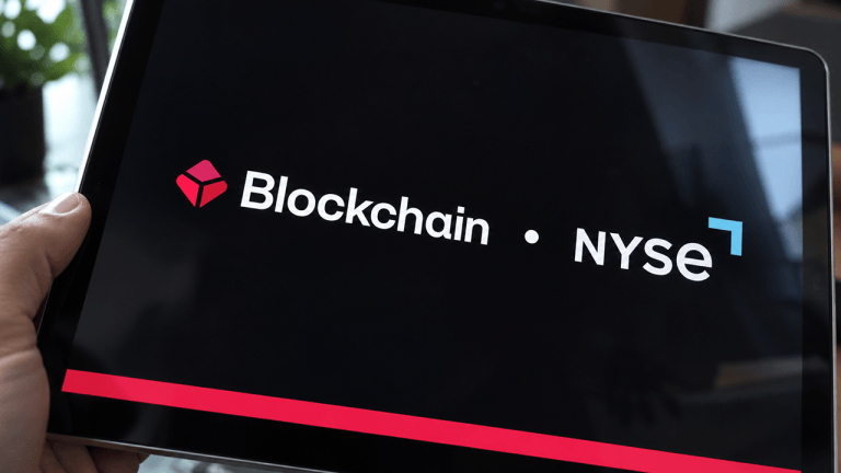 Blockchain.com and NYSE logos on a tablet.